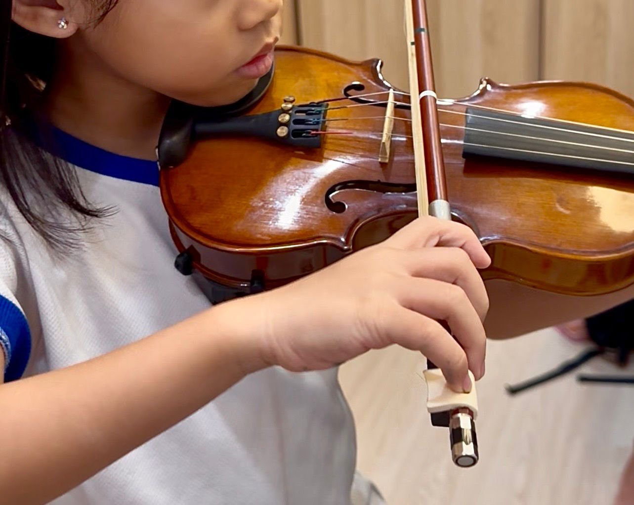 A young student's bow hold and violin posture
