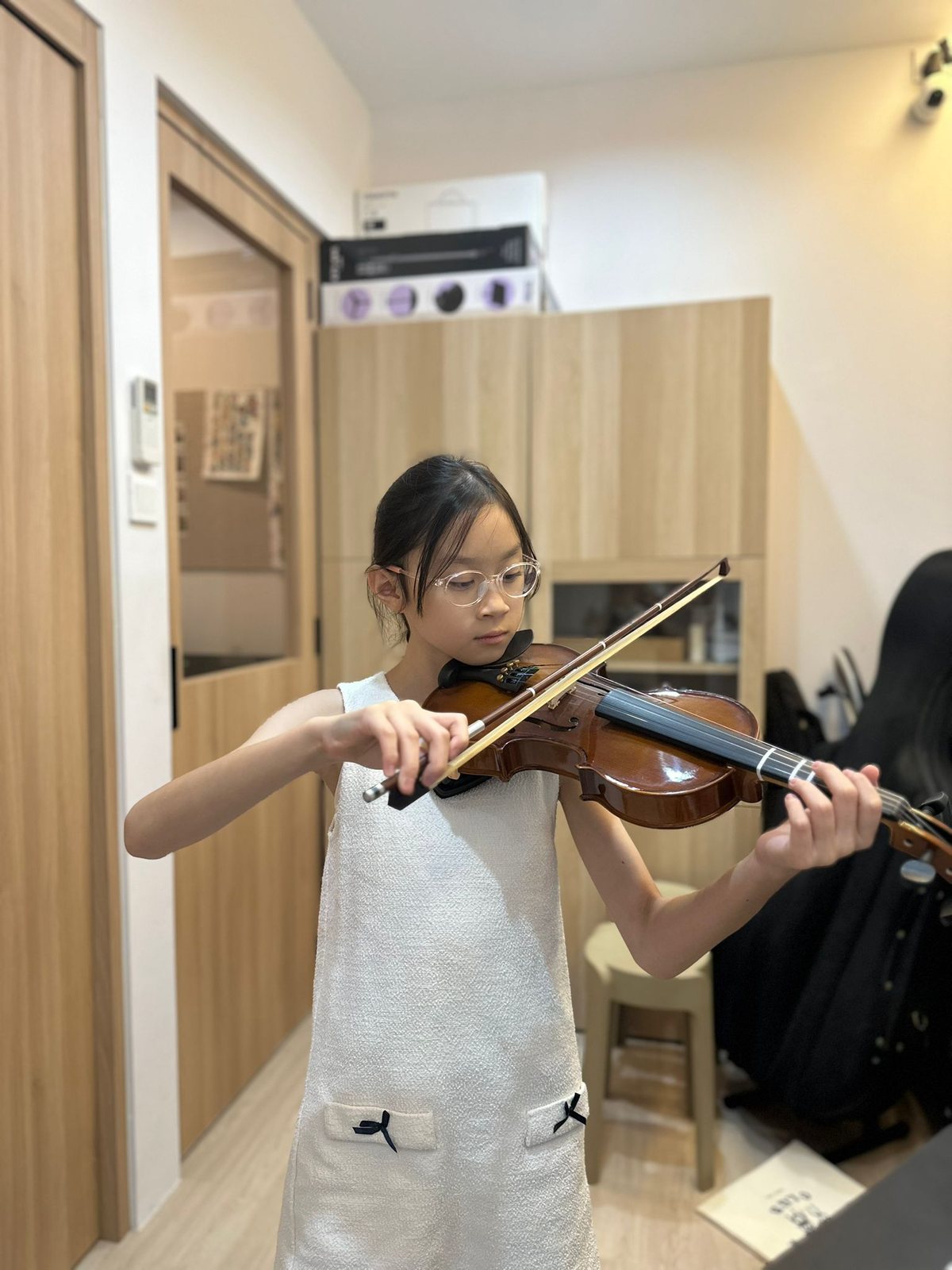 A young student in a private violin lesson at Bowed Strings Music Studio